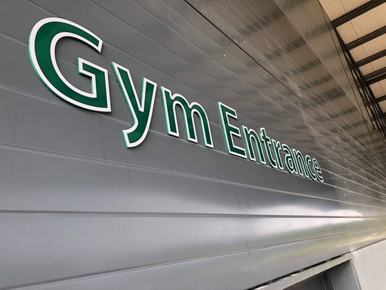 An image of a gym entrance signage.